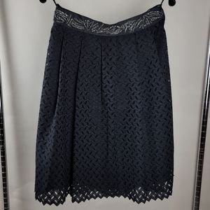 Pleated black lace skirt with beaded waist